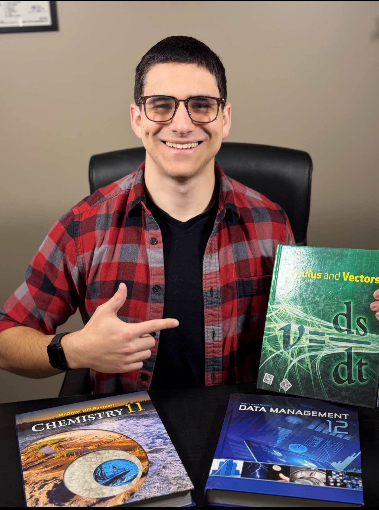 Jesus Corrado, J.C., with math and science textbooks